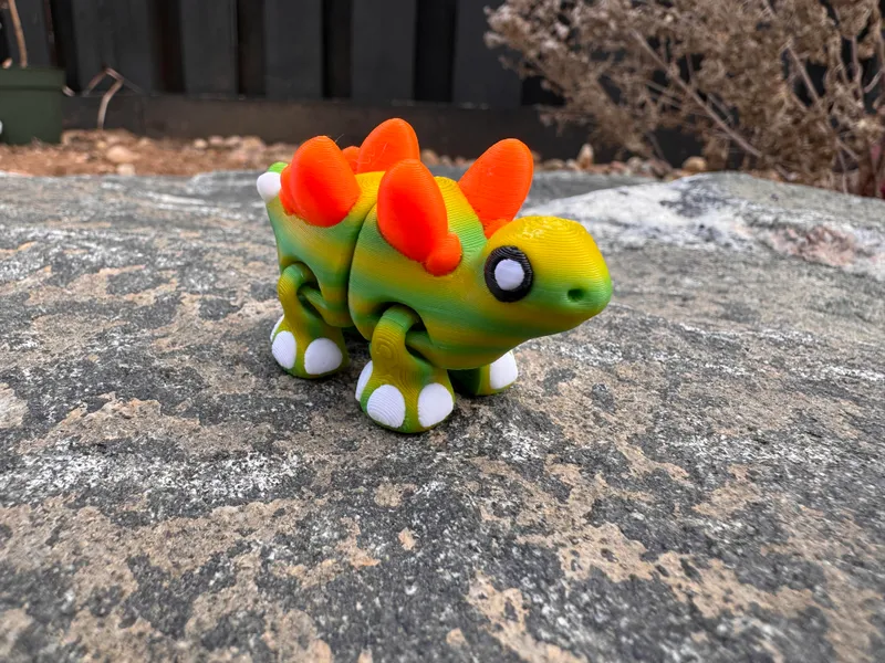 Stella the Stegosaurus - Stay Awhile Rentals mascot